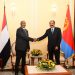 “Sudan-Eritrea leaders discussing regional stability in Africa during diplomatic visit.”