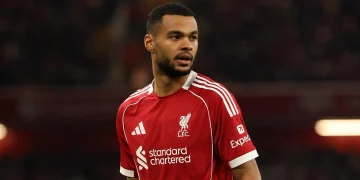 Cody Gakpo of Liverpool celebrates scoring a crucial equalizer against Fulham at Craven Cottage, January 2026.