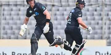 New Zealand vs Bangladesh 1st ODI 2026: Live Updates and Full Match Analysis The international cricket calendar for 2026 reaches a fever pitch as the new zealand vs bangladesh 1st ODI gets underway today, April 17, 2026. Taking place at the iconic Sher-e-Bangla National Cricket Stadium in Dhaka, this match marks the beginning of a crucial three-match series. As part of our dedicated Africa News Update 2026 sports coverage, we are providing in-depth analysis of how this clash between the Black Caps and the Tigers is unfolding in real-time. For the USA audience and global fans, this series represents more than just a bilateral contest; it is a battle for ranking points and a test of depth for both nations. Bangladesh enters the arena with the momentum of a historic series win against Pakistan, while New Zealand aims to prove their adaptability on the turning tracks of the subcontinent despite missing several marquee players. The Opening Clash: New Zealand vs Bangladesh in Mirpur The atmosphere in Mirpur was electric as the coin went up. In a move that surprised some analysts but stayed true to Kiwi strategy in Asia, New Zealand won the toss and elected to bat first. The logic was clear: avoid batting last on a surface that historically breaks up and offers excessive turn as the night progresses. Toss and First Innings: New Zealand Sets the Target The New Zealand top order faced a stern test against the new ball. Shoriful Islam, leading the Bangladeshi attack, extracted early movement, removing the openers cheaply. However, the middle order showed remarkable composure. New Zealand eventually posted a competitive total of 247/8 in their 50 overs. The innings was defined by a calculated partnership between Henry Nicholls and Dean Foxcroft. While the scoring rate remained modest throughout the middle overs, the Kiwis focused on keeping wickets in hand for a late-innings flourish. Bangladesh’s spinners, led by Mehidy Hasan Miraz, were economical, but the visitors managed to navigate the "spin web" to set a target that would require a disciplined chase. Africa News Update 2026: Global Impact of the Series Under the banner of Africa News Update 2026, we observe that this series is attracting significant viewership across the African continent and the USA. Cricket's global expansion has led to increased interest in how "subcontinent specialists" like Bangladesh handle a top-tier side like New Zealand. With the 2027 World Cup on the horizon, every run and wicket in this new zealand vs bangladesh series is a data point for selectors and fans alike. Deep Dive: Key Performers and Match Milestones The Kiwi Resilience: Foxcroft and Nicholls Lead the Way Henry Nicholls proved his worth as a senior statesman in this squad, scoring a gritty 68 off 83 balls. His ability to rotate strike against the spinners was the cornerstone of the Kiwi innings. Alongside him, Dean Foxcroft showcased his T20-honed skills, striking a rapid 59 that included eight boundaries. Their partnership ensured that despite a late-order collapse sparked by Taskin Ahmed, New Zealand had a total their bowlers could defend. The Tigers’ Response: Saif Hassan and Litton Das Anchor the Chase As the chase began, Bangladesh looked to their reliable openers. At the current mark of 135/4 after 28 overs, the game hangs in the balance. Saif Hassan has been the standout, reaching his half-century (57 off 76 balls) before being dismissed. Litton Das remains a crucial figure in the dugout, having contributed a steady 46. The current run rate of 4.82 is just below the required 5.14, setting the stage for a dramatic finish under the Dhaka floodlights. Tactical Analysis: The Spin Web at Sher-e-Bangla The new zealand vs bangladesh rivalry is often decided by how well the visitors play spin. Today, the Mirpur pitch is playing true to its reputation. The ball is gripping and turning, particularly for Rishad Hossain, who claimed two vital wickets. New Zealand’s bowlers, led by Nathan Smith, have responded by using cross-seam deliveries and slower balls to mimic the variations of the local spinners. The tactical battle between Bangladesh's aggressive sweep-shot hitters and the Kiwis' disciplined line and length is the highlight of the second innings. Head-to-Head Stats: New Zealand vs Bangladesh History Historically, New Zealand has dominated the head-to-head record, especially at home. however, in Bangladesh, the "Tigers" are a different beast. Total ODIs Played: 45 (Approximate until 2026) New Zealand Wins: 31 Bangladesh Wins: 13 No Result: 1 The gap has narrowed significantly in the last three years, with Bangladesh winning their last two home series against SENA (South Africa, England, New Zealand, Australia) nations. Looking Ahead: What to Expect in the 2nd ODI Regardless of today's result, the 2nd ODI scheduled for April 20 will be a must-watch. If New Zealand defends this total, they will have mastered the conditions. If Bangladesh chases it down, they confirm their status as a dominant home force. We expect New Zealand to perhaps bring in another spin option for the next game, while Bangladesh will look to tighten their middle-order strike rotation. Conclusion: A Thrilling Start to the 2026 Tour The new zealand vs bangladesh 1st ODI has lived up to the hype, providing a perfect balance between bat and ball. For fans following our Africa News Update 2026, this match is a testament to the growth of international cricket and the unpredictability of the ODI format. Stay tuned for the final result and post-match presentations. For more sports deep dives, visit our Sports Category or catch up on the latest Business trends affecting global sports broadcasting.